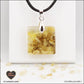 Pendentif Citrine chauffée carré M.1 en orgonite laiton