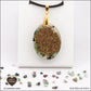 Ruby-Zoisite oval pendant M.2 in brass orgonite