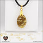 Pendentif Citrine chauffée ovale M.1 en orgonite laiton