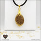 Pendentif Citrine chauffée ovale M.1 en orgonite laiton