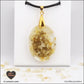 Pendentif Citrine chauffée ovale M.2 en orgonite laiton