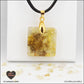 Pendentif Citrine chauffée carré M.1 en orgonite laiton