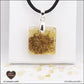 Pendentif Citrine chauffée carré M.1 en orgonite laiton