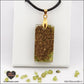 Rectangular Peridot pendant M.2 in brass orgonite