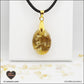 Pendentif Citrine chauffée ovale M.1 en orgonite laiton