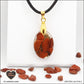 M.1 oval red jasper pendant in brass orgonite