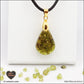 Peridot drop pendant in brass orgonite