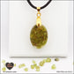 Oval Peridot pendant M.1 in brass orgonite