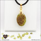 Oval Peridot pendant M.1 in brass orgonite