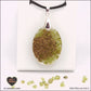 Oval Peridot pendant M.2 in brass orgonite