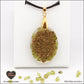 Oval Peridot pendant M.2 in brass orgonite