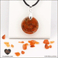 Pendentif Cornaline rond M.1 en orgonite laiton