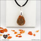 Carnelian drop pendant in brass orgonite