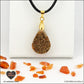 Carnelian drop pendant in brass orgonite