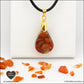 Carnelian drop pendant in brass orgonite