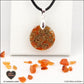 Pendentif Cornaline rond M.1 en orgonite laiton