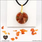 Pendentif Cornaline rond M.1 en orgonite laiton