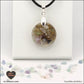 Pendentif Fluorite rond M.1 en orgonite laiton