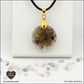 Pendentif Fluorite rond M.1 en orgonite laiton