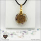 Pendentif Fluorite rond M.1 en orgonite laiton